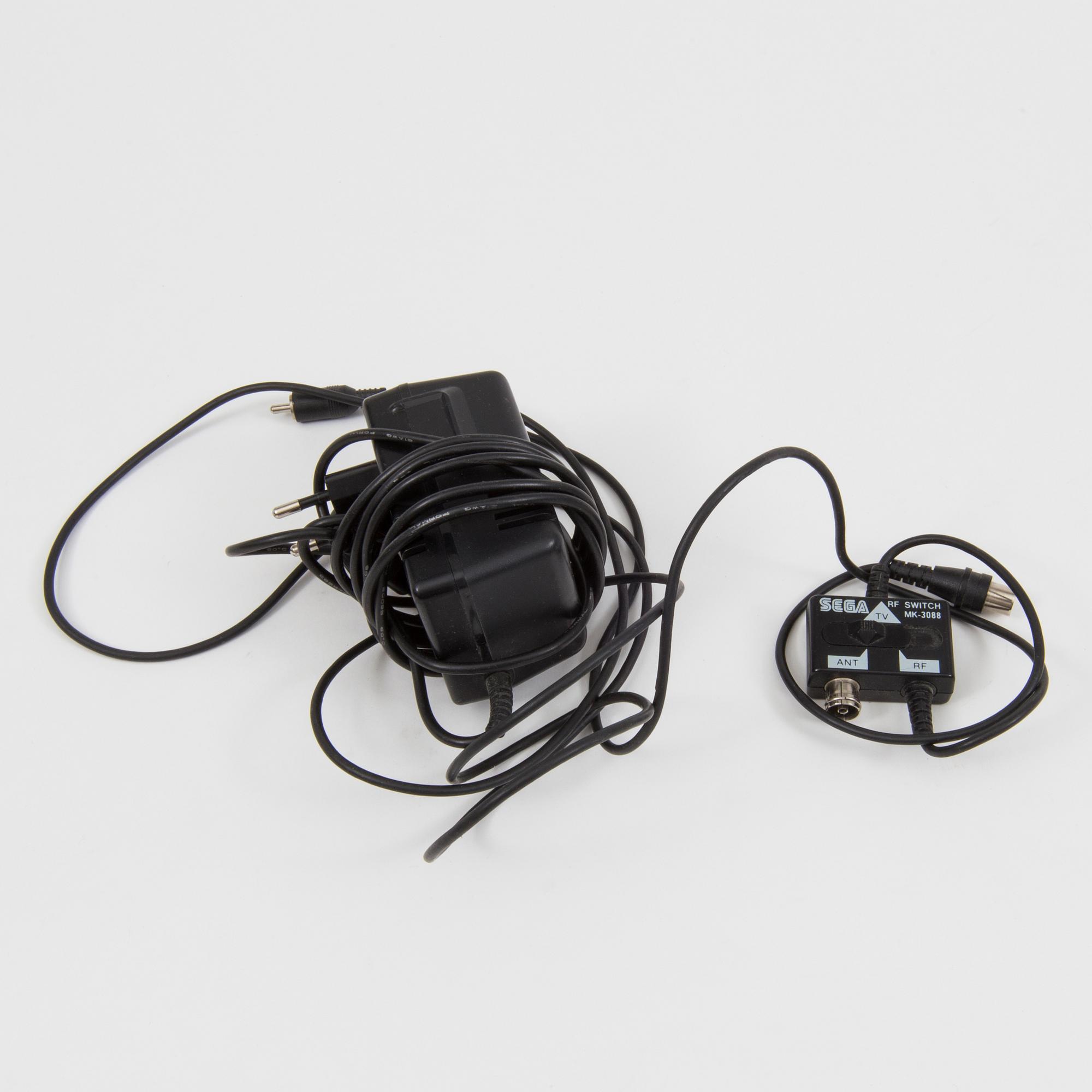 A "Sega Mega Drive" and nine games, 1990.s.