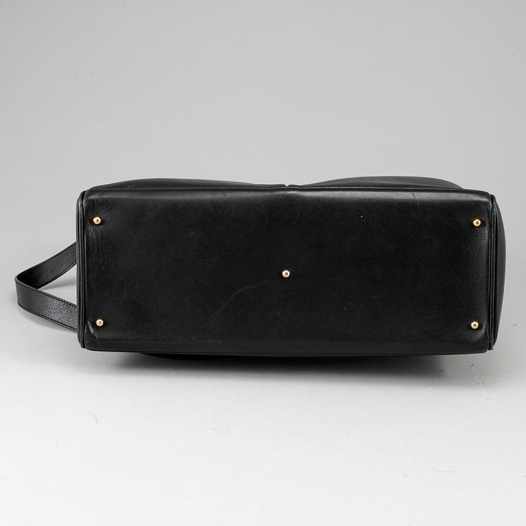 GUCCI, a leather bag/briefcase.