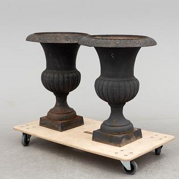 A pair of cast iron plant pots, late 20th century.