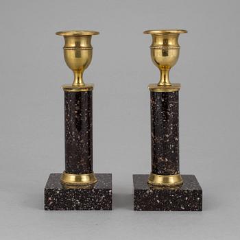 A pair of late gustavian porphyry candle sticks early 19th century.