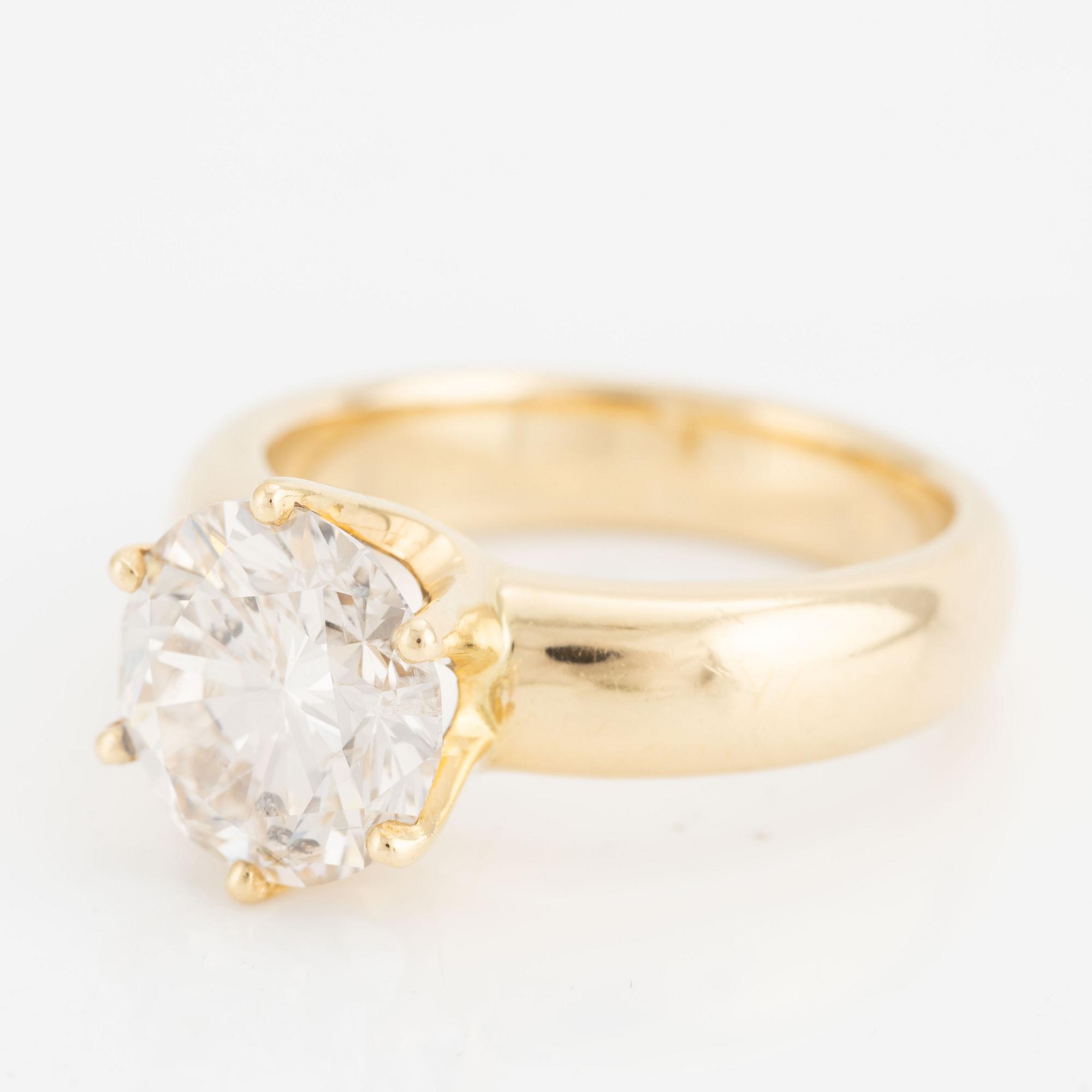 Ring, 18K gold with a round brilliant-cut diamond.