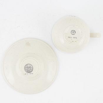 Stig Lindberg, a' Birka' cup with saucer, with royal monogram under crown, Gustavsberg, 1976.