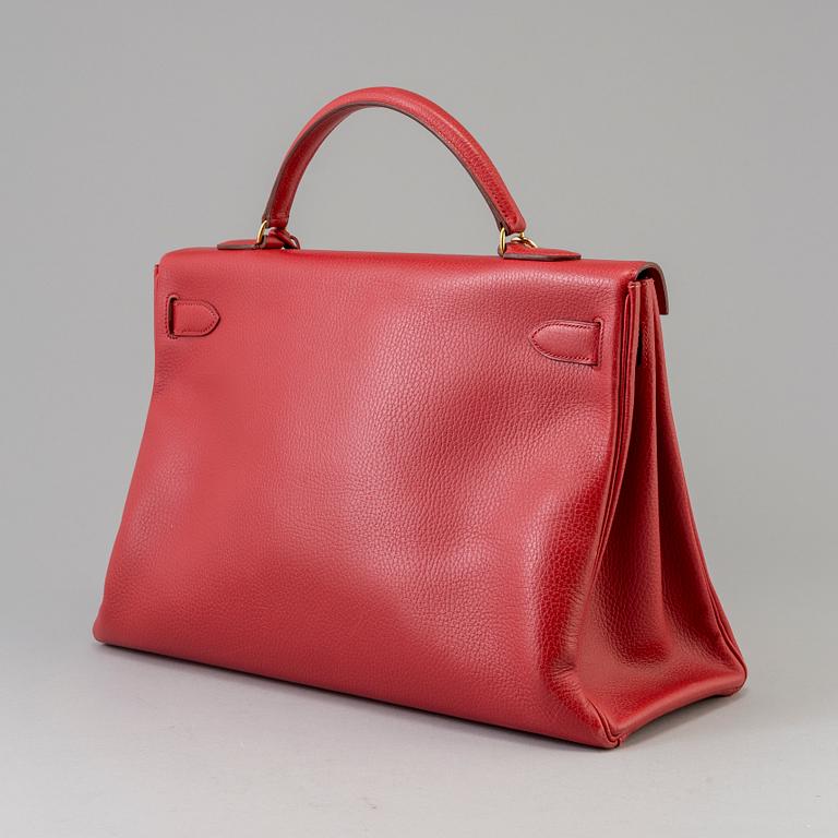 A red Epson "Kelly 40" bag by Hermès 1991.