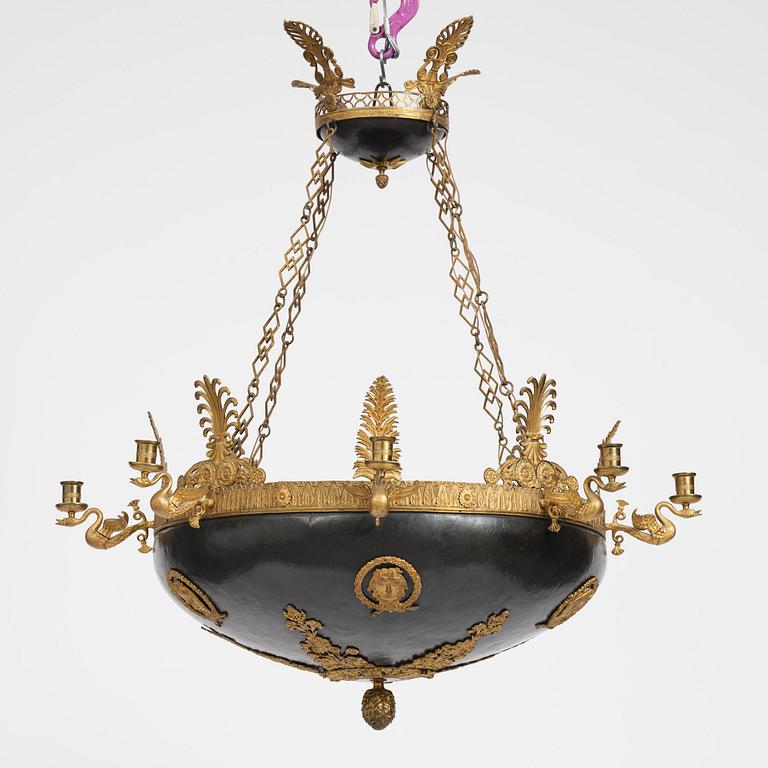 A presumably Russian Empire gilt and patinated bronze nine-branch chandelier, 19th century.