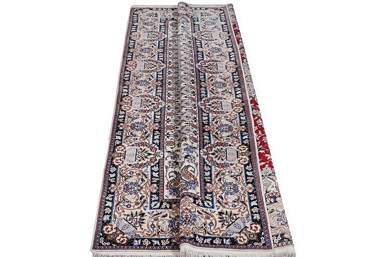 A Nain carpet, part silk, 6 laa, c.303 x 184 cm.