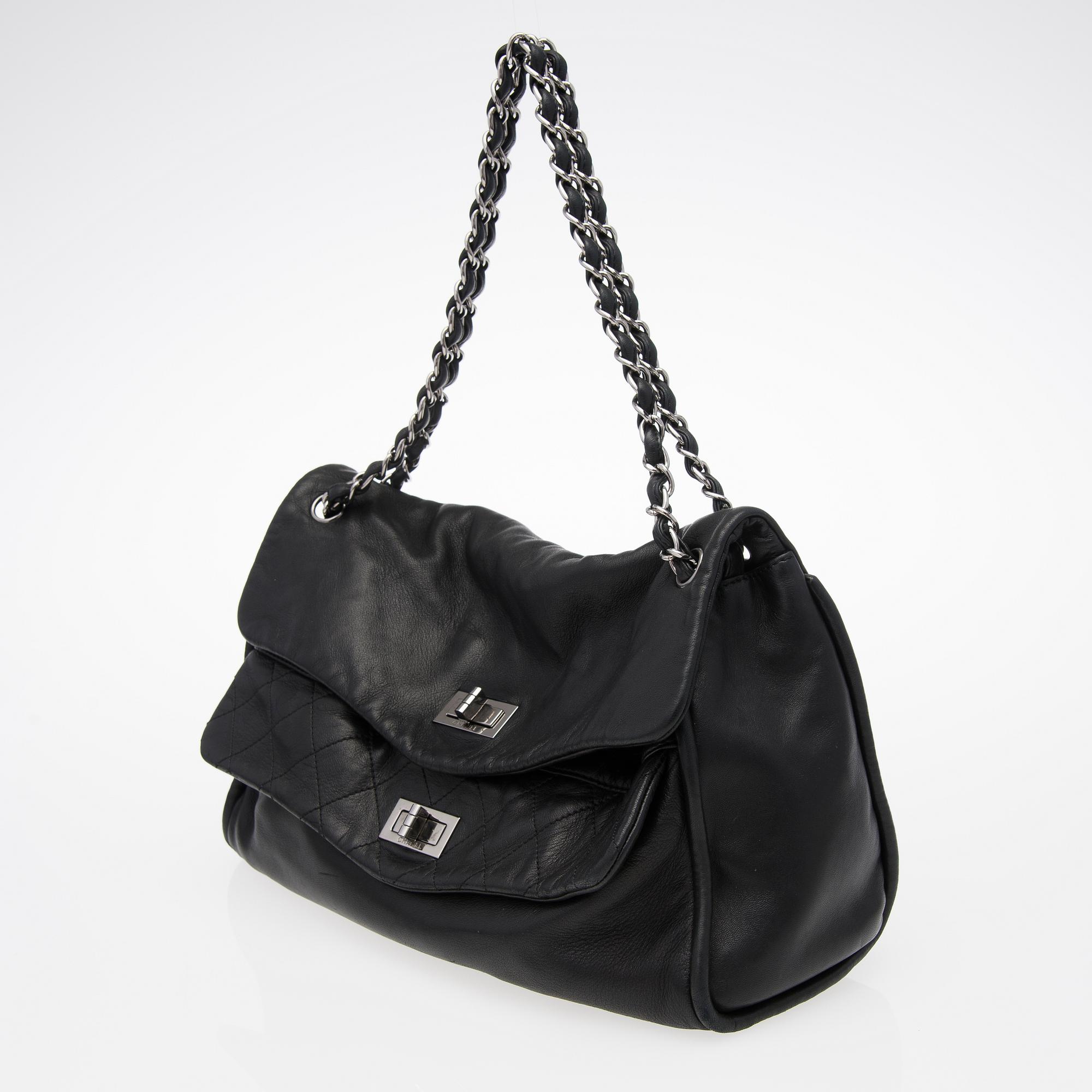 A Black Leather Double Mademoiselle Lock Flap Bag.