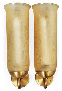 496. A pair of Bo Notini brass and yellow glass wall lamps, Glössner & Co, Stockholm 1940's-50's.