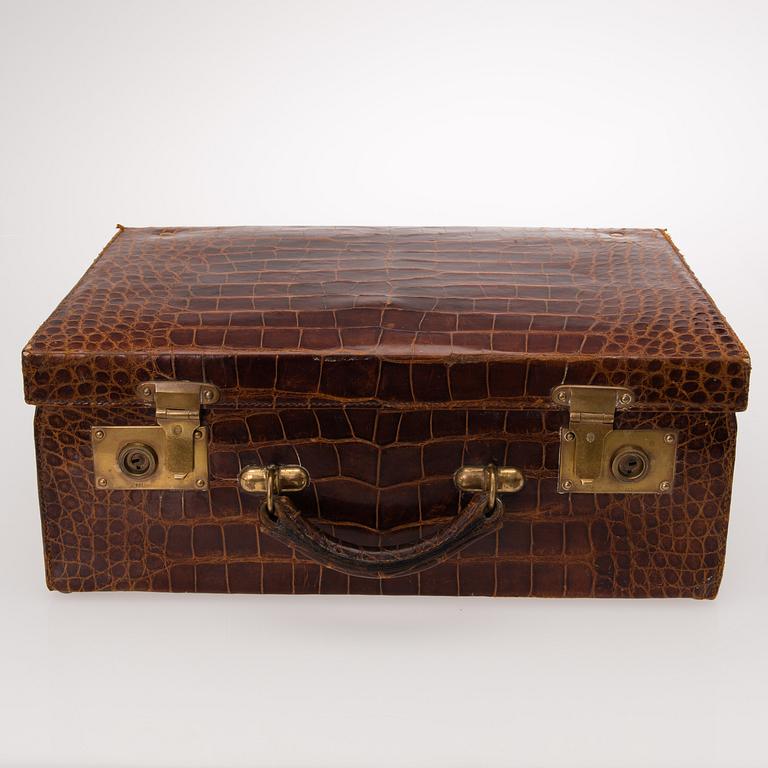 A TRAVEL TOILET CASE, leather, German 1910-20s, boxes with silver lid.