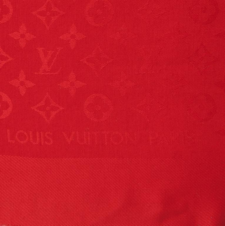 LOUIS VUITTON, a red monogrammed wool and silk shawl.