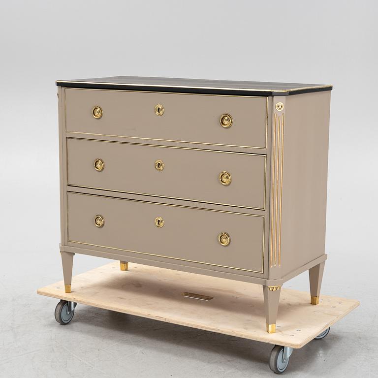 A painted Gustavian style chest of drawers from around the year 1900.