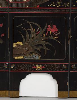 A Chinese four panel lacquer folding screen, first part of the 20th century.