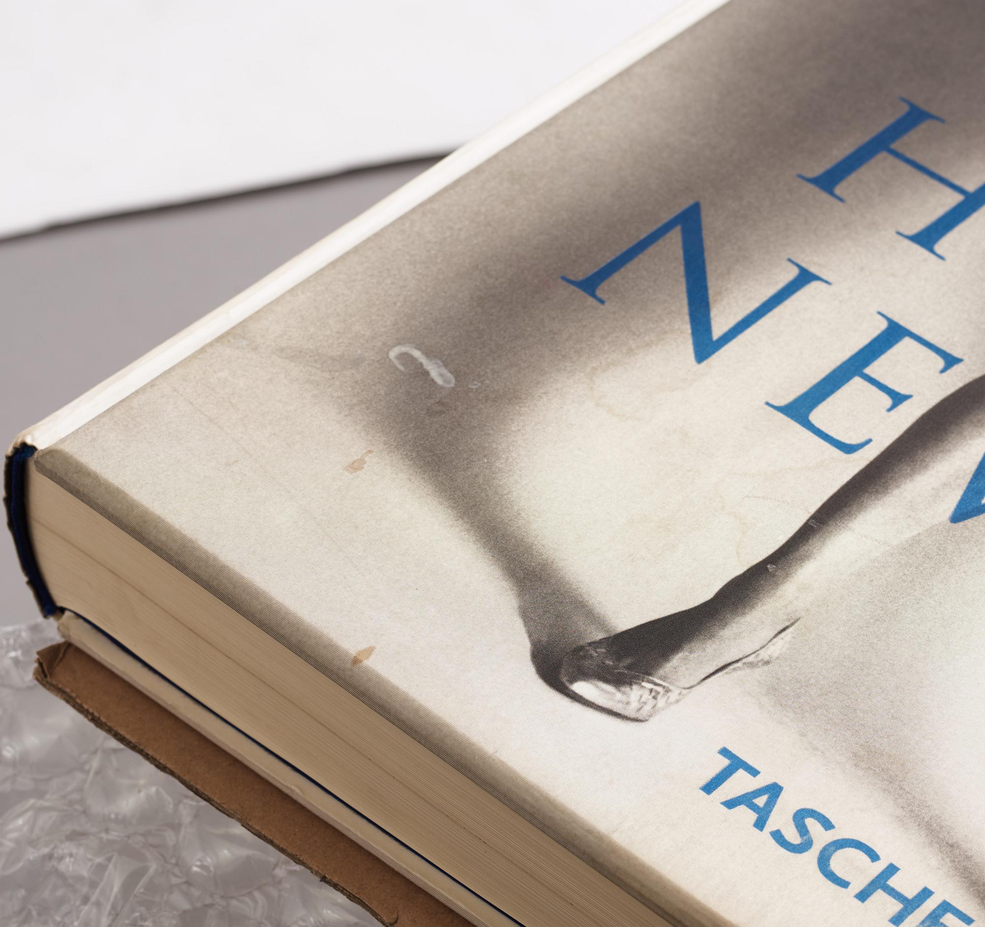 Helmut Newton, Signed book published by Taschen, Monte Carlo, 1999, ed 10000, with a metal table.