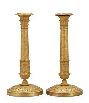 A pair of French Empire early 19th Century candlesticks.