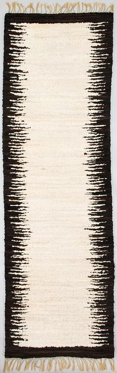 A sheepskin carper for Furcarpet. Circa 300x95 cm.