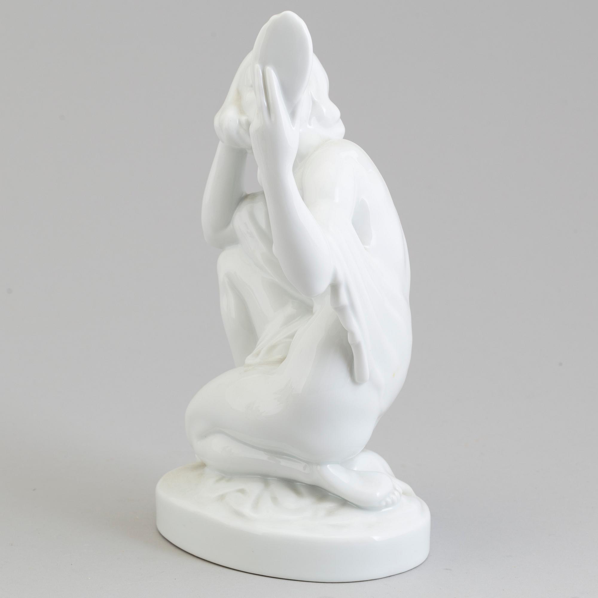 A Herend white glazed porcelain figure, Hungary, 20th Century.