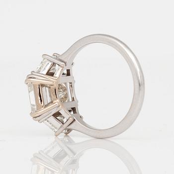 A 4.05ct emerald cut diamond ring. Quality circa I/VS.