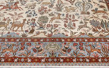 A semi-antique Ghom carpet, approx. 390 x 290 cm.