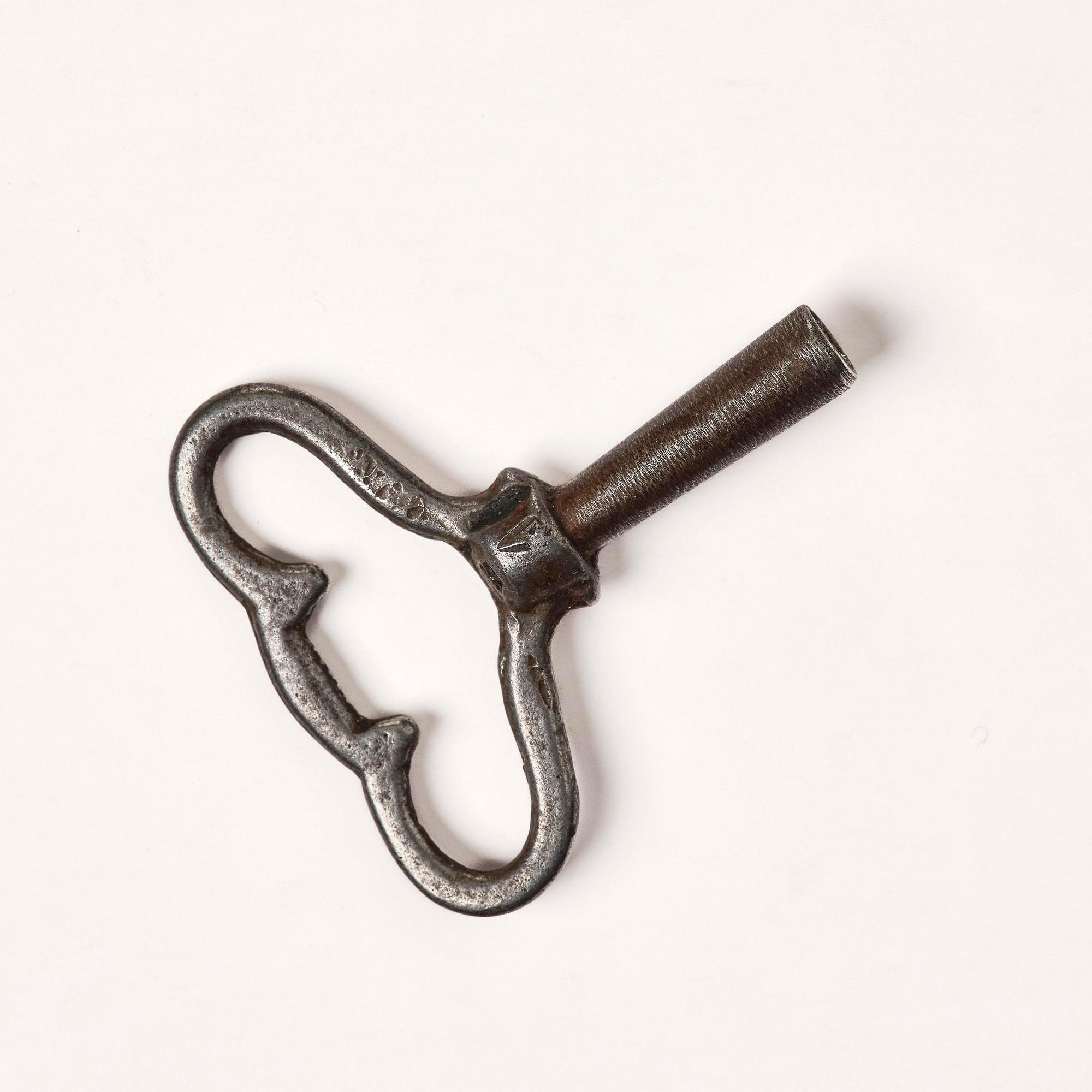 A French Louis XVI ormolu and marble lyre-shaped mantel clock, late 18th century.