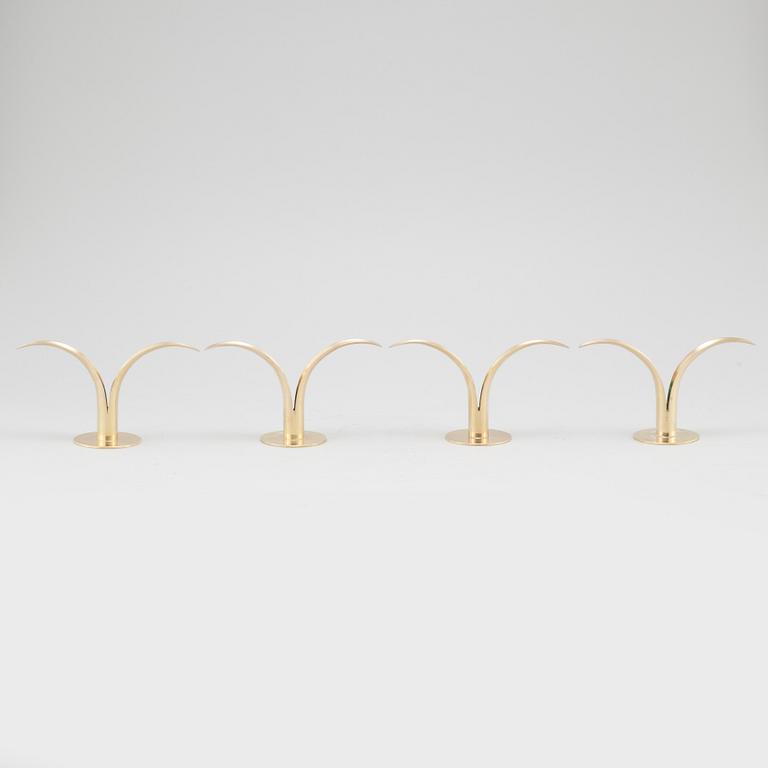 Four brass candle sticks "Liljan" by Ivar Ålenius-Björk for Ystad metall, second half of the 20th century.