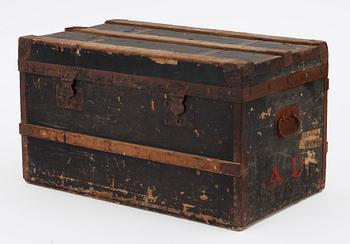 A late 19th century black trunk by Louis Vuitton.