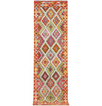A Kilim runner carpet, c. 291 x 80 cm.