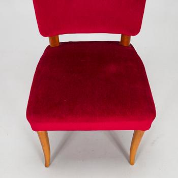 A mid 20th century dining table and a set of four chairs, Oy Boman Ab and two chairs Werner West.