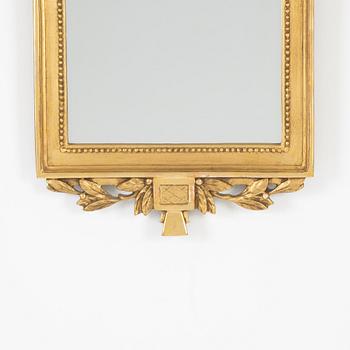 A Gustavian style mirror, mid 20th Century.