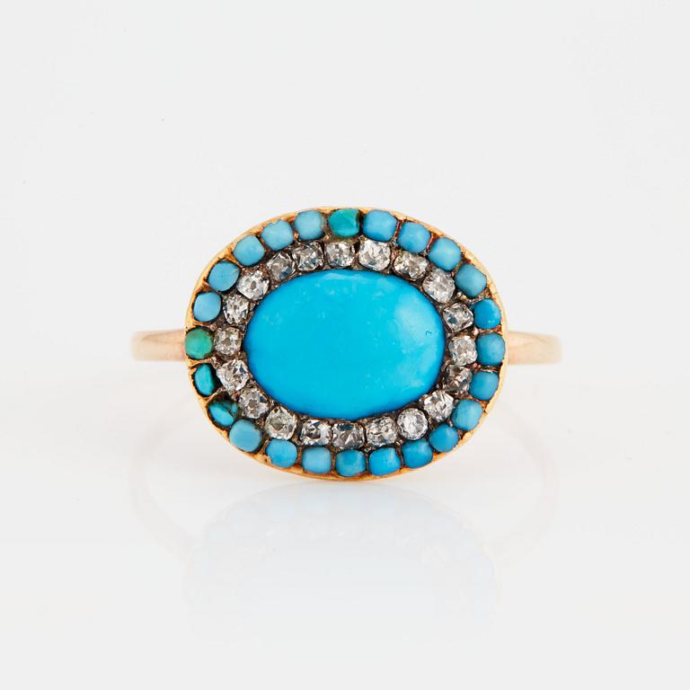 A 14K gold ring set with turquoises and old-cut diamonds.