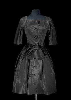 1509. A 1960s black silk cocktail dress.