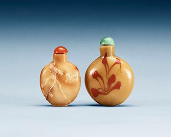 1367. A glass and a stone snuff bottle, 20th Century.