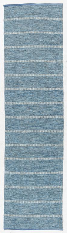 A flat weave runner, mid-20th century, c. 268 x 70 cm.