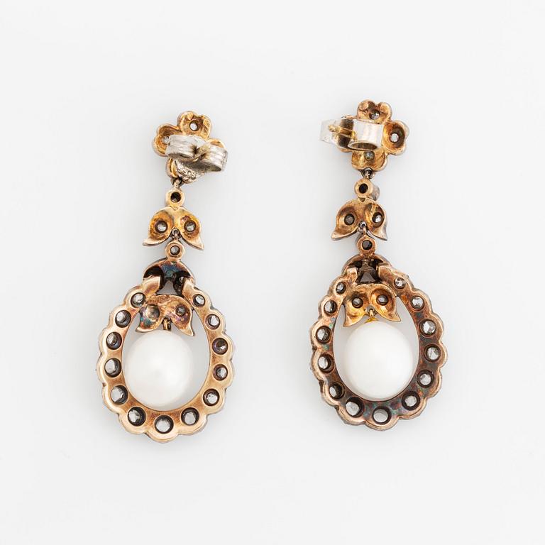 A pair of silver and gold earrings set with pearls and rose-cut diamonds.