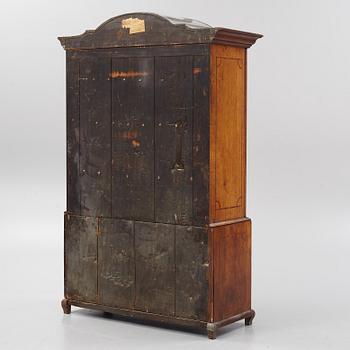 An oak rococo cabinet, mid 18th Century.
