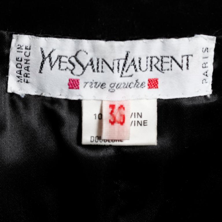 YVES SAINT LAURENT, a two-piece suit consisting of jacket and skirt.