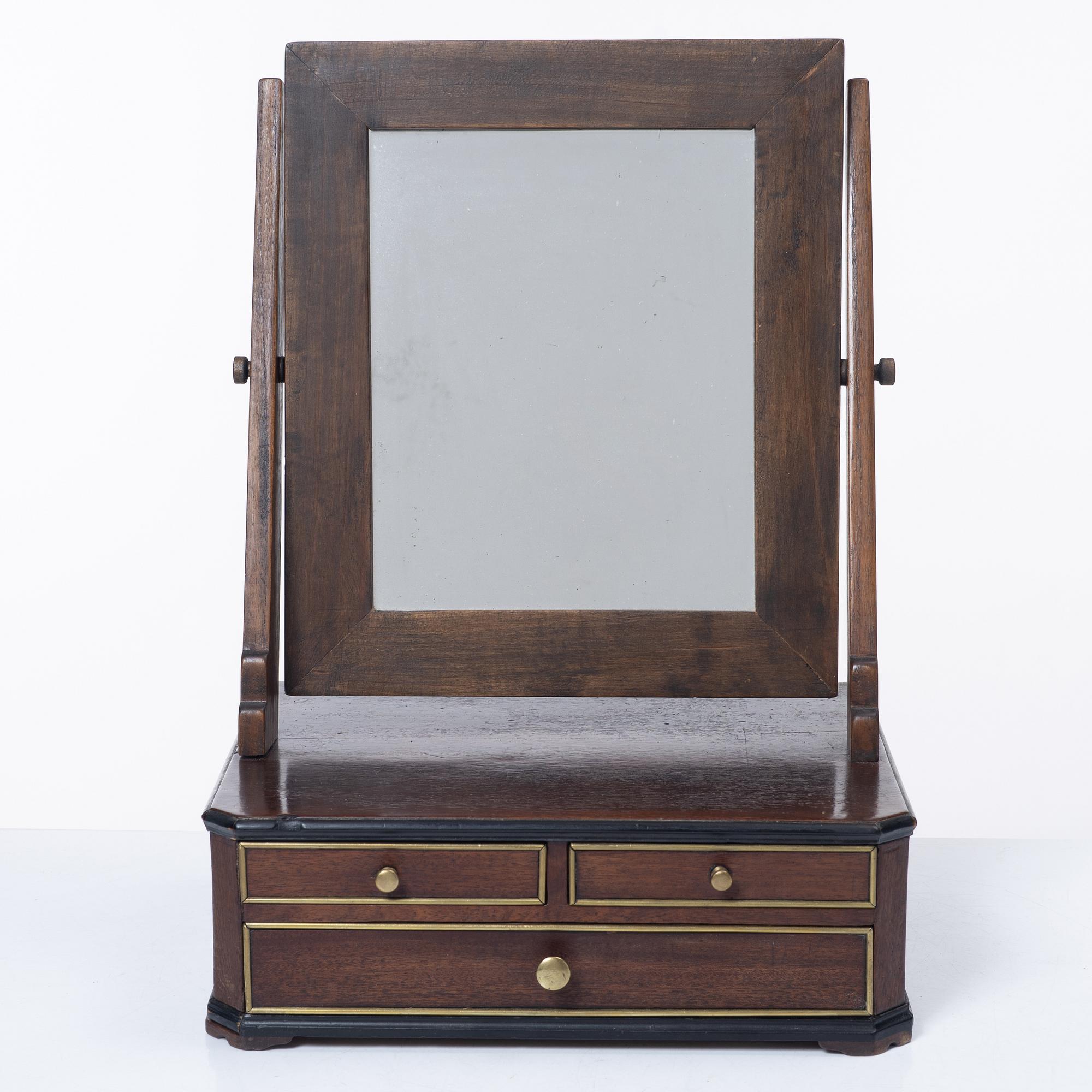 A mahogany table mirror, Sweden, dated 1820.