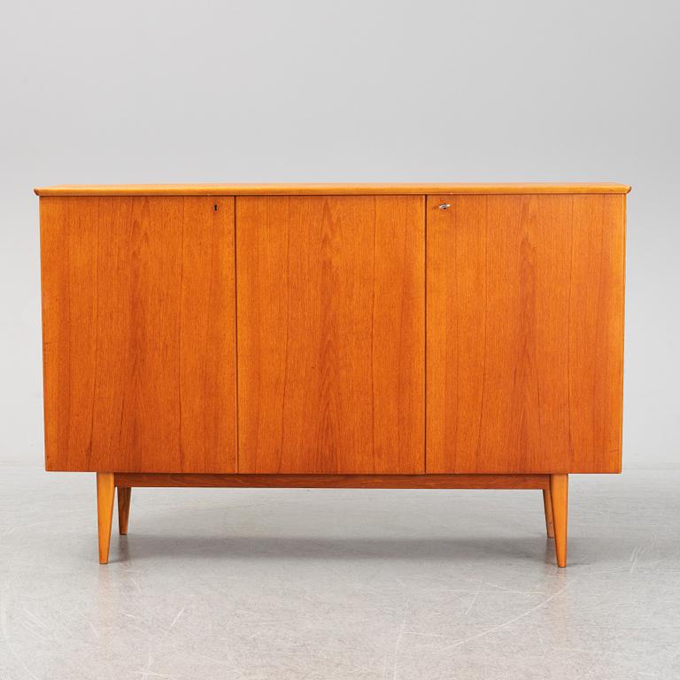 A mid 20th century teak veneered sideboard.