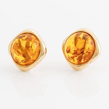 A pair of 14K gold earrings with amber.
