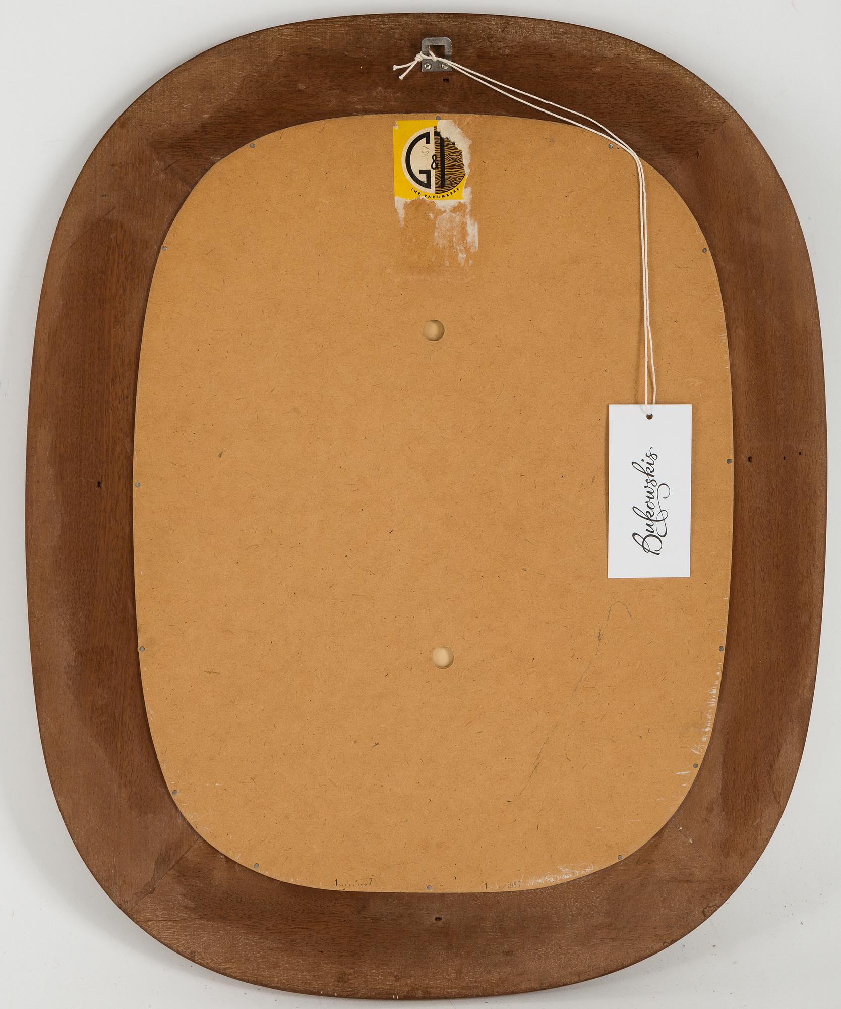 A Swedish Modern mahogany mirror from Glas&Trä, Hovmantorp, dated 1957.