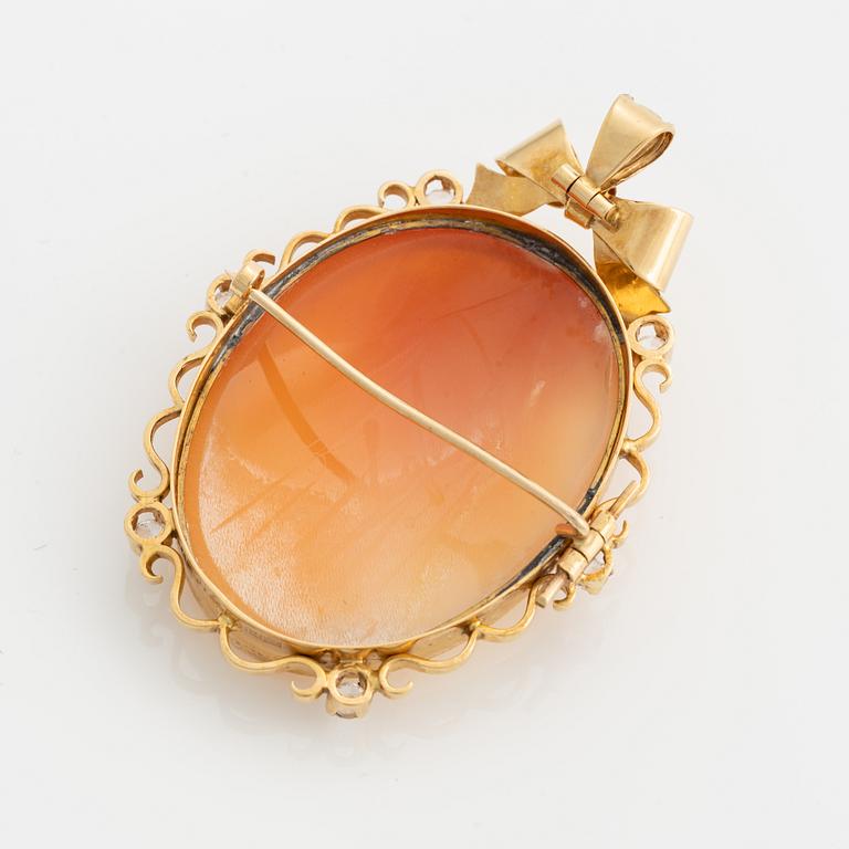 Pendant/brooch in 18K gold with a shell cameo and white stones.