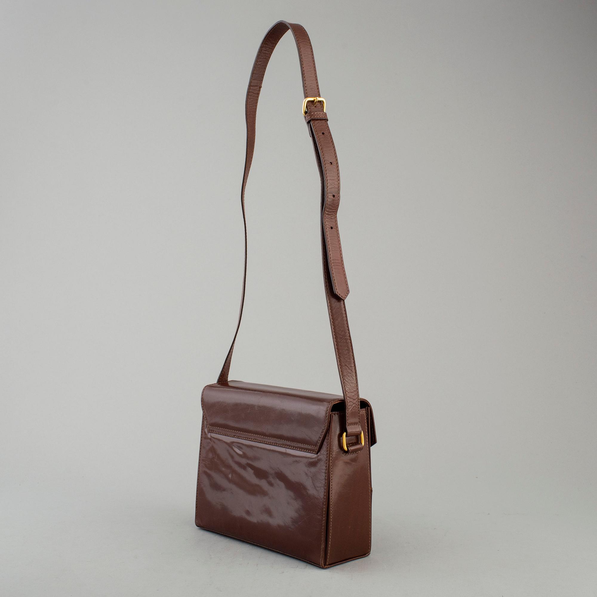 ESCADA, a brown leather handbag.
