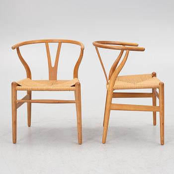Hans J. Wegner, four model CH-24/ 'Wishbone' chairs, Carl Hansen, Odense, Denmark, second half of the 20th century.