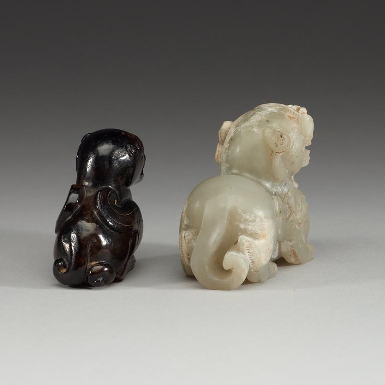 Two Chinese stone figures of mythical beasts.