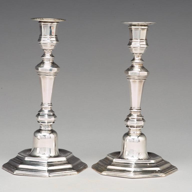 A pair of European 18th century silver candlesticks, unidentified makers mark.