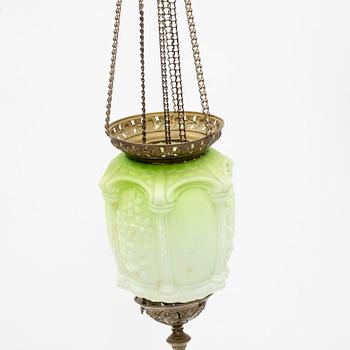 An art noveau glass and brass ceiling lamp from around the year 1900.