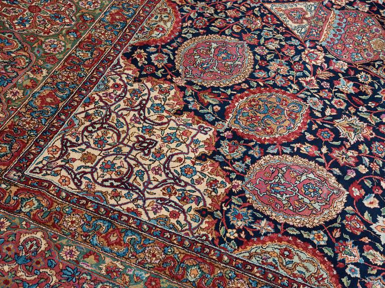 A CARPET. A semi-antique Kerman. 614,5 x 360,5 cm.