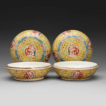 448. A pair of circular yellow ground and famille rose 'dragon' boxes with covers,  late Qing dynasty.
