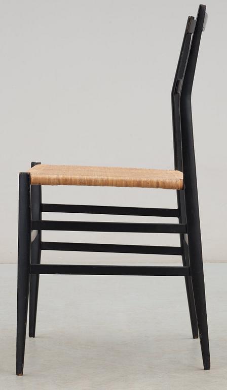 A Gio Ponti 'Superleggera' chair, Cassina, Italy, black painted ash with ratten seat.