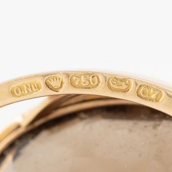 Brosch 18K guld med en fasettslipad rökkvarts.