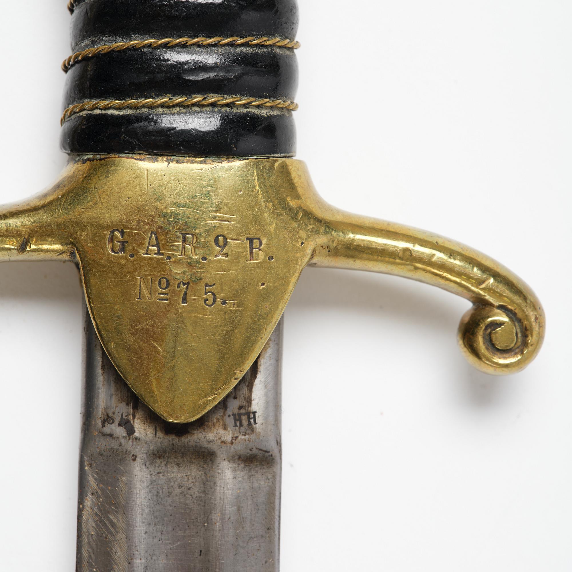 A Swedish artillery sword, 1889 pattern, with scabbard.