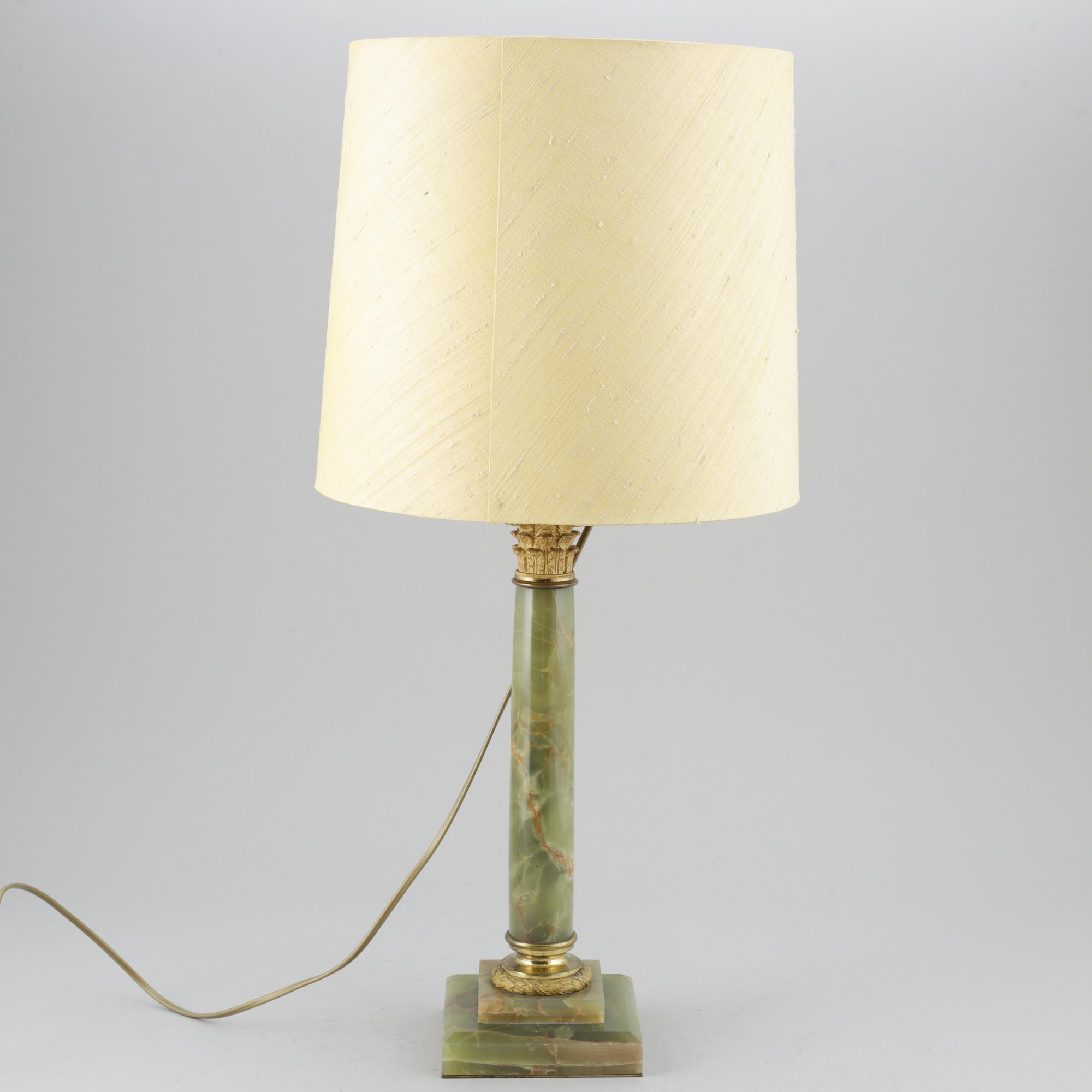 A 20th century empire style table lamp.